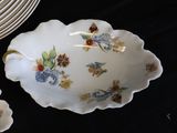 many plates and bowls that are sitting on a table