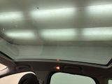 a view of the sunroof from inside of a car