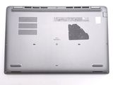 a laptop that is sitting on a white surface