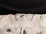 a white shirt sitting on top of a wooden table
