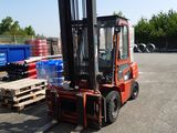 a forklift truck that is parked in a parking lot