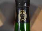 a close up of a bottle of wine on a table
