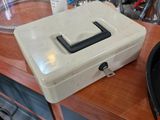 a white box sitting on top of a wooden table