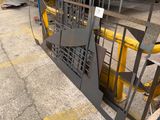 an image of a forklift being loaded onto a truck