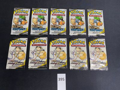 six packs of pokemon trading cards sitting on a table