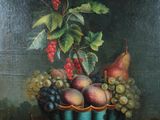 tableau représentant une corbeille de fruits posée sur une table, dans laquelle se trouve une plante