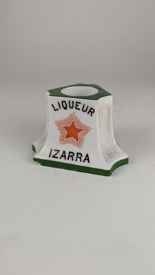 an image of a bottle of liquor sitting on top of a white table