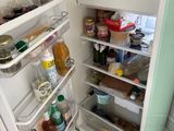 an open refrigerator with a lot of food inside of it
