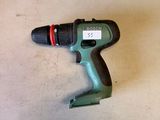 a cordless drill that is laying on the floor