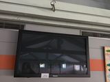 a flat screen tv mounted on the wall in a room