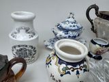 many different types of vases sitting on a table