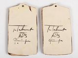 two tags with the names of two people on them