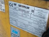 a close up of a yellow machine with a label on it
