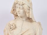 a statue of a woman holding a flower in her hand