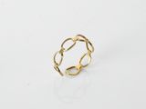 an image of a gold ring on a white surface