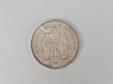 the coin is sitting on a white surface with a white background