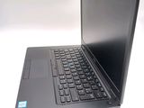 a laptop with a black keyboard on a white surface
