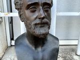 a bust of a man with a beard and a mustache