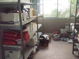 a room with a lot of boxes and boxes on the shelves