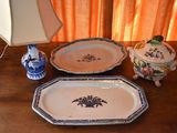 two trays and a lamp on a wooden table