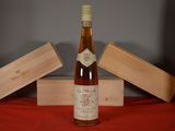 a bottle of wine sitting on a table next to a box