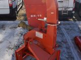 a red machine that is sitting in a parking lot
