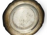a silver plate that is sitting on a table