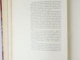 an open book with a picture of a cat on it