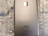 an apple iphone 6s is sitting on top of a plastic wrapper