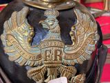 a black helmet with a gold eagle on it