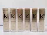 quatre boîtes de produits capillaires Kerassene posées sur une surface blanche