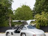 an image of a silver sports car parked in a parking lot