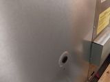 a stainless steel refrigerator that is on a wooden pallet