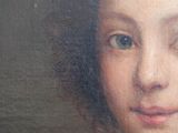 portrait of a young girl in a green dress with a white collar