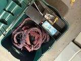 a green case with a bunch of items inside of it