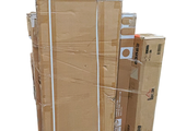 several cardboard boxes stacked on top of each other on a white surface