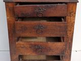 an old wooden chest of drawers with four drawers on top of it