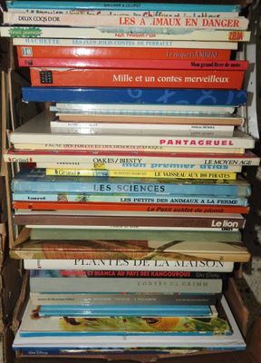 many books stacked on top of each other on a shelf