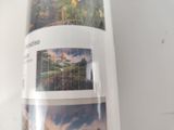a picture of a picture of a mountain scene on the back of a skateboard