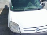 a white van that is parked in a parking lot