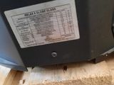 a close up of a machine that is on a piece of wood