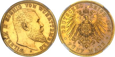 a gold coin with an image of a man and a eagle on it