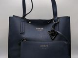 a close up of a handbag with a purse attached to it