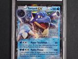 a close up of a pokemon trading card in a plastic holder
