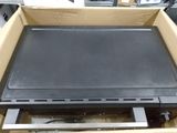 a box with a laptop in it sitting on a table