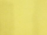 a yellow wall with a clock on it in a room