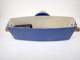 an image of a blue and white boat shaped object on a white surface