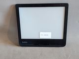 a small television sitting on the floor in front of a white wall