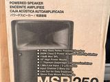 boxes of speakers are stacked on top of each other on a table