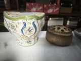 a vase sitting on a table next to a wooden box